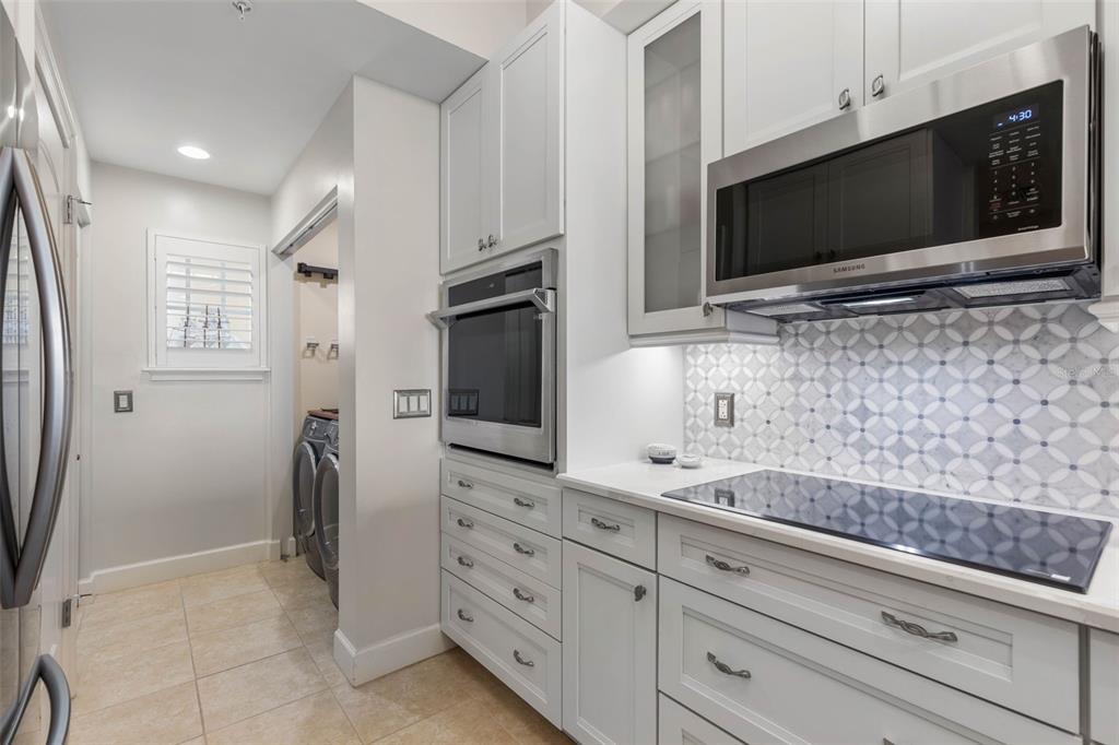 102 Yacht Harbor Drive, Unit 567 Palm Coast, FL 32137 - Photo 14 of 59 a living room with stainless steel appliances kitchen island granite countertop a sink and a microwave