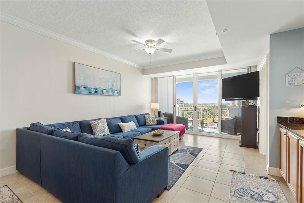 102 Yacht Harbor Drive, Unit 567 Palm Coast, FL 32137 - Photo 19 of 59 a living room with furniture and a flat screen tv