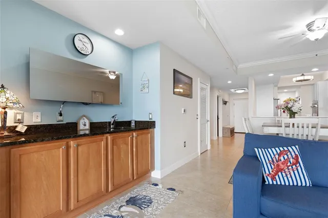 a large bedroom with a bed and a chandelier