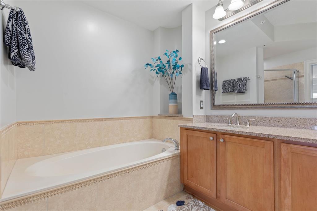 102 Yacht Harbor Drive, Unit 567 Palm Coast, FL 32137 - Photo 30 of 59 a bathroom with a bathtub and a sink