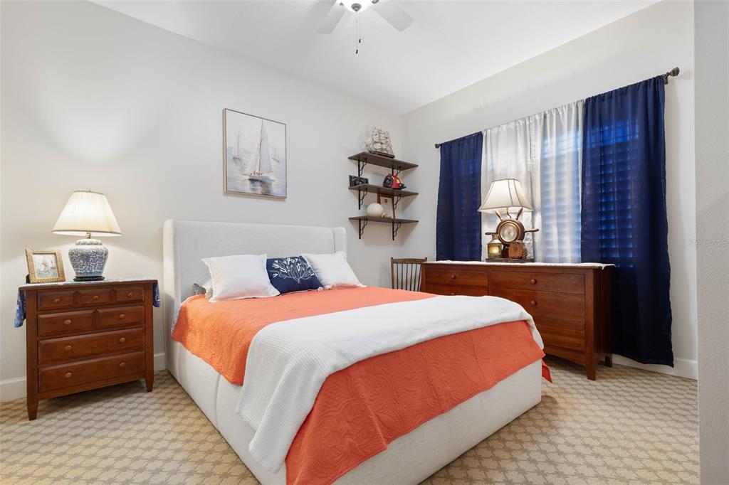 102 Yacht Harbor Drive, Unit 567 Palm Coast, FL 32137 - Photo 32 of 59 a bedroom with a bed and a dresser