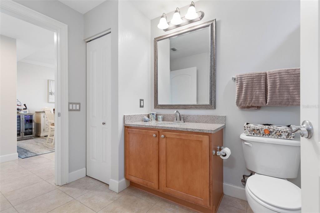 102 Yacht Harbor Drive, Unit 567 Palm Coast, FL 32137 - Photo 35 of 59 a bathroom with a toilet a sink a tub and mirror