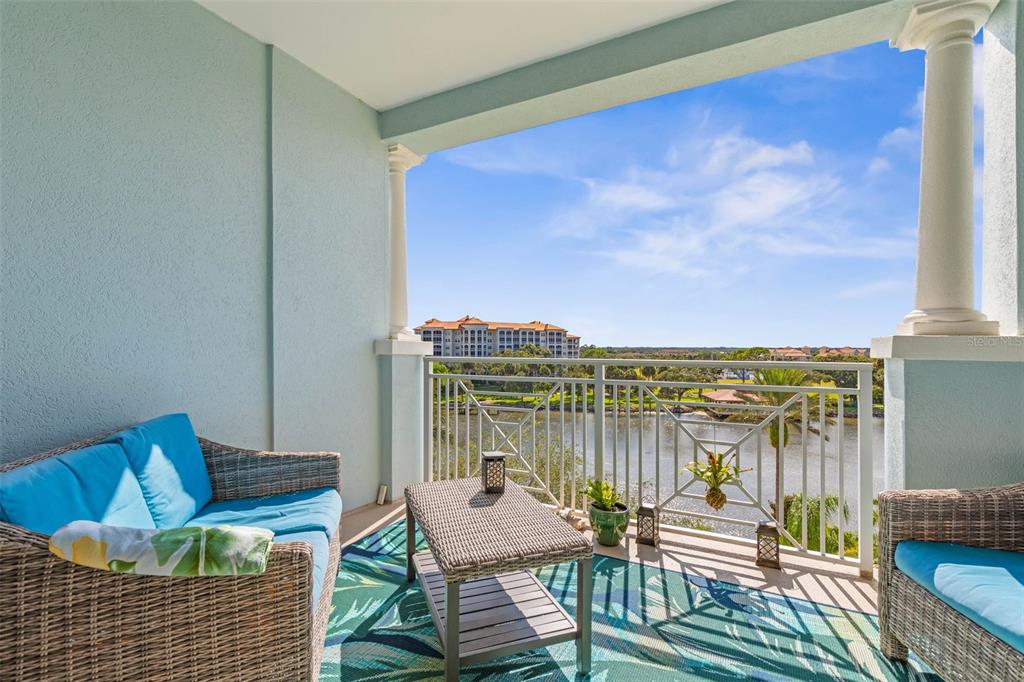 102 Yacht Harbor Drive, Unit 567 Palm Coast, FL 32137 - Photo 37 of 59 a view of a balcony with chairs and wooden floor