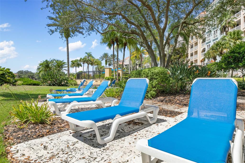 102 Yacht Harbor Drive, Unit 567 Palm Coast, FL 32137 - Photo 40 of 59 a view of a chairs and table in patio with a lake view