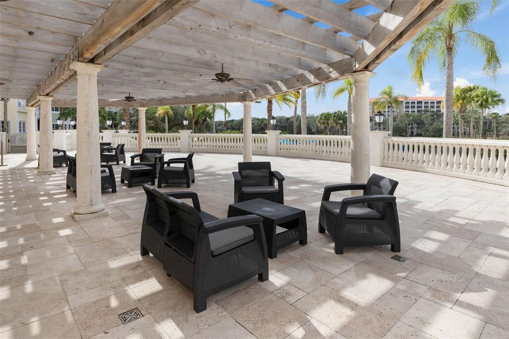 102 Yacht Harbor Drive, Unit 567 Palm Coast, FL 32137 - Photo 51 of 59 a living room with patio furniture and a floor to ceiling window