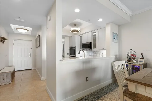a large kitchen with stainless steel appliances granite countertop a sink and cabinets