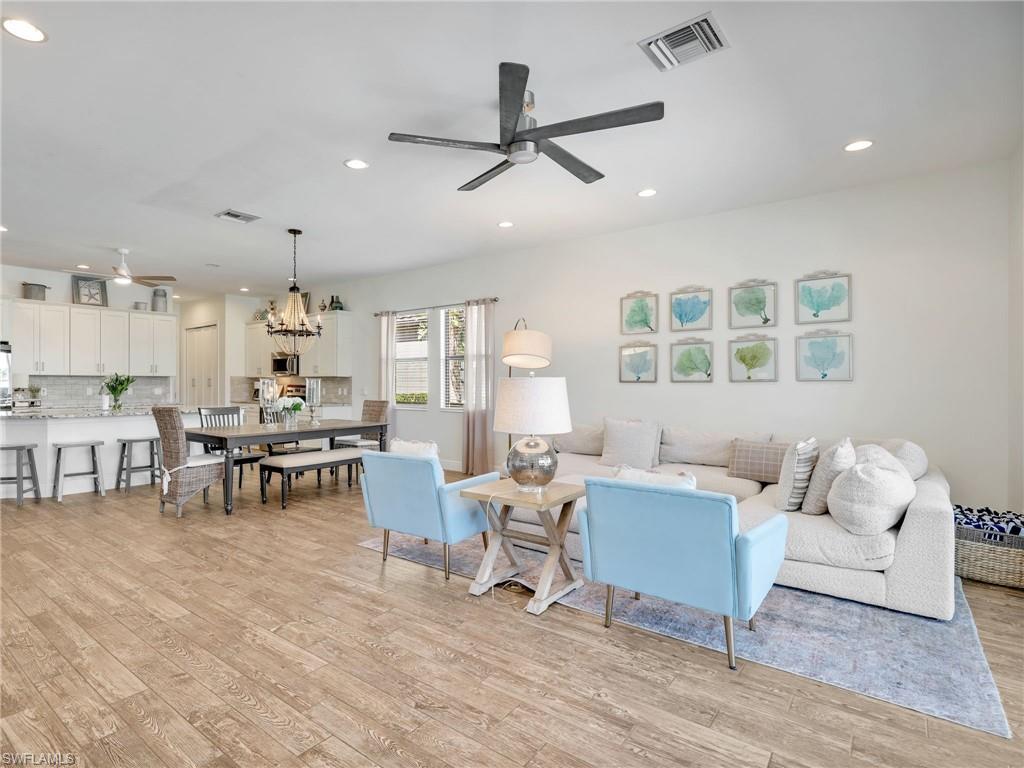 4743 Abaca Circle Naples, FL 34119 - Photo 13 of 50 Living area featuring a ceiling fan, light wood-type flooring, and recessed lighting