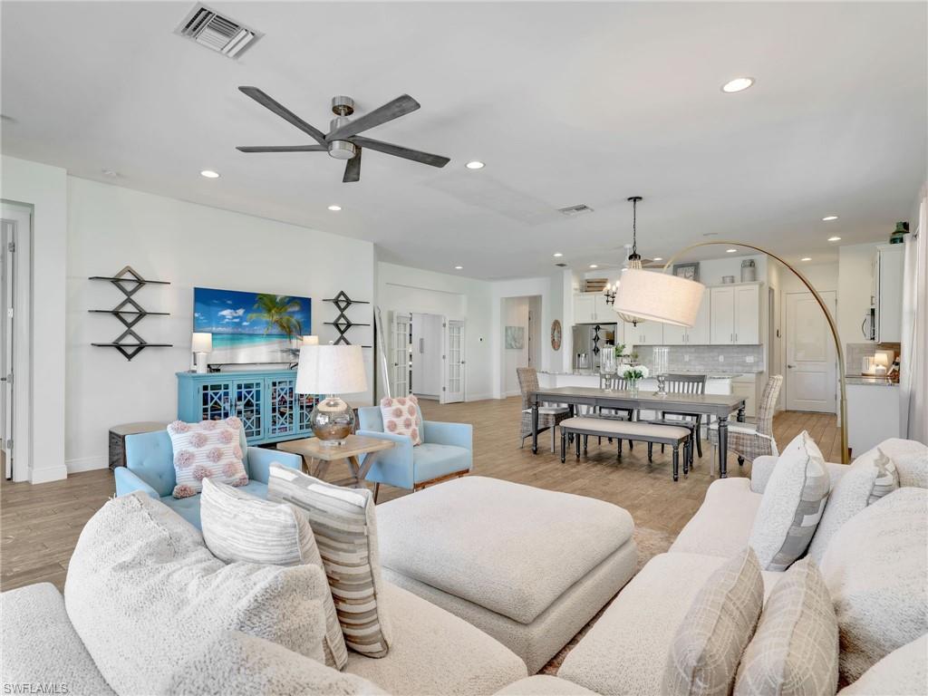 4743 Abaca Circle Naples, FL 34119 - Photo 14 of 50 Living room with light wood-type flooring, recessed lighting, and ceiling fan