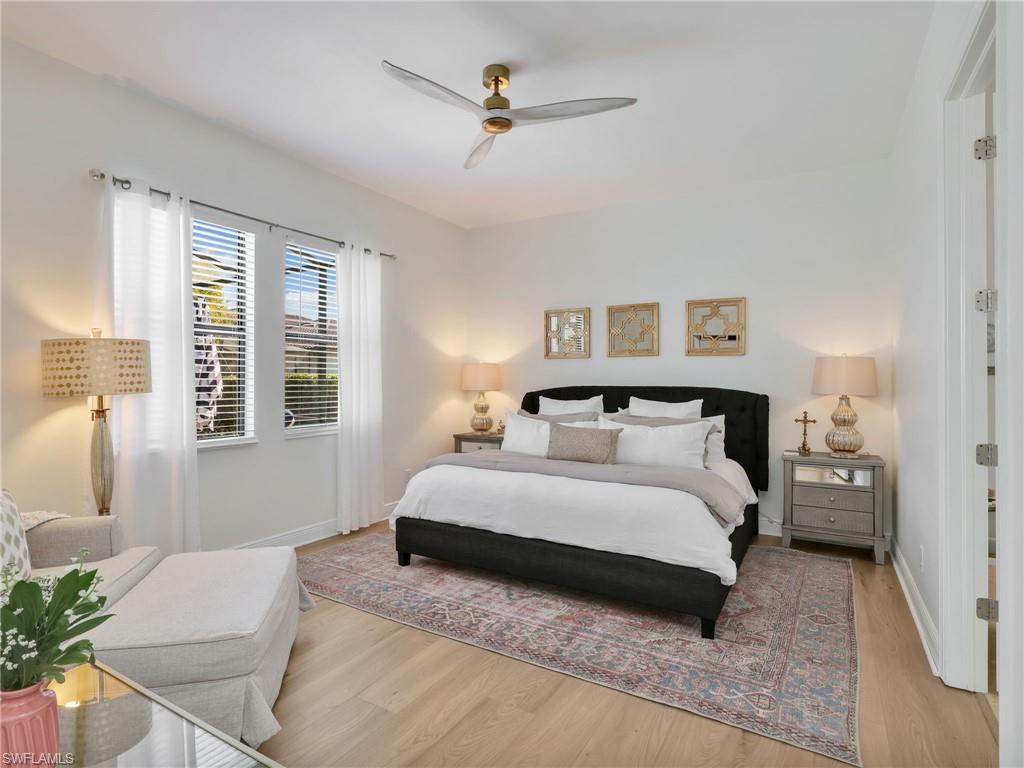 4743 Abaca Circle Naples, FL 34119 - Photo 21 of 50 Bedroom with wood finished floors and ceiling fan
