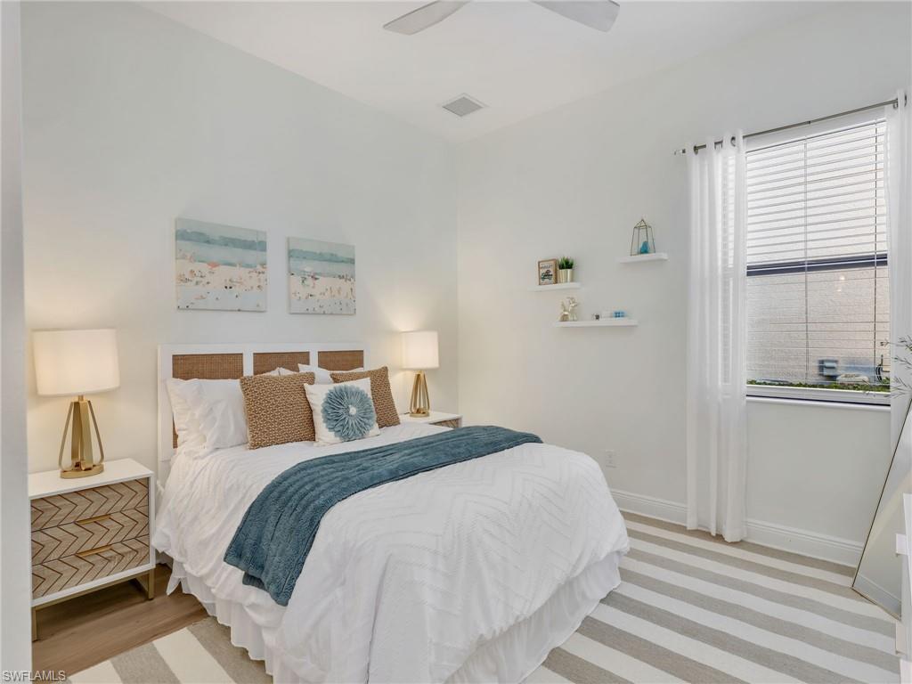 4743 Abaca Circle Naples, FL 34119 - Photo 28 of 50 Bedroom featuring baseboards and a ceiling fan