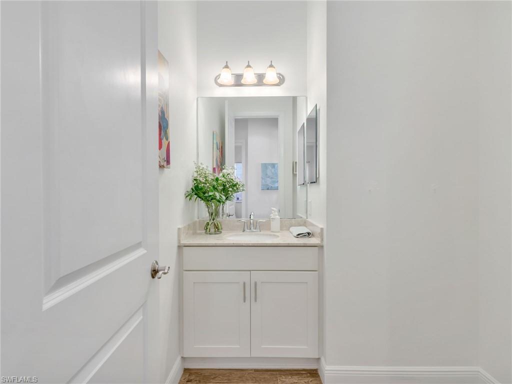 4743 Abaca Circle Naples, FL 34119 - Photo 31 of 50 Bathroom with vanity and baseboards