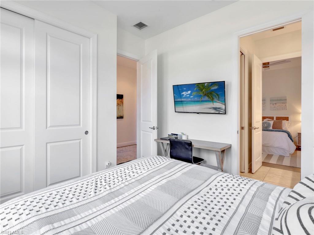 4743 Abaca Circle Naples, FL 34119 - Photo 32 of 50 Bedroom featuring a closet and light tile patterned flooring