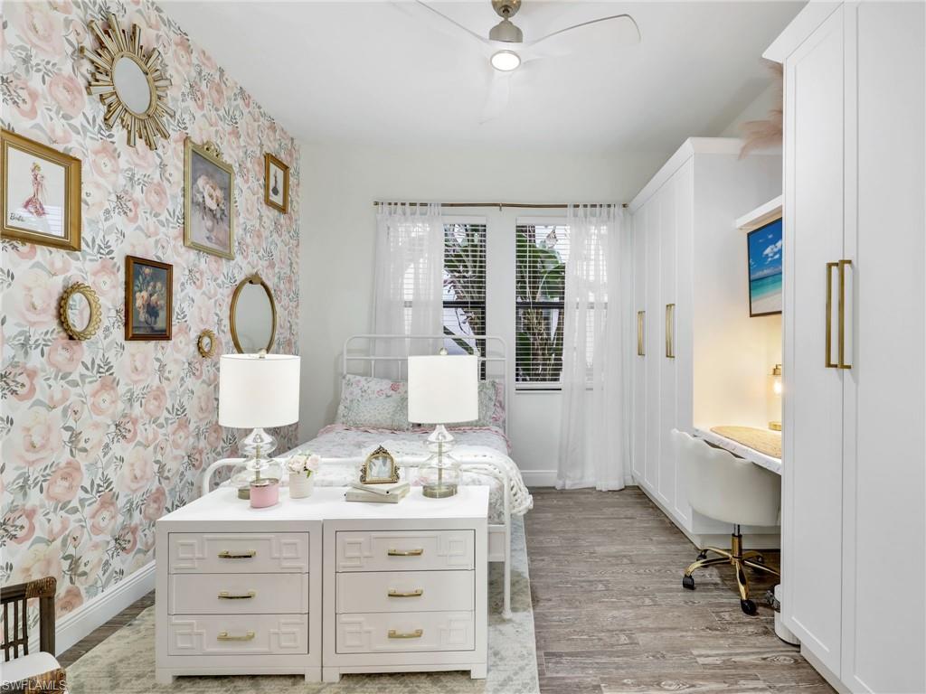 4743 Abaca Circle Naples, FL 34119 - Photo 35 of 50 Bedroom with light wood-style flooring, ceiling fan, and wallpapered walls