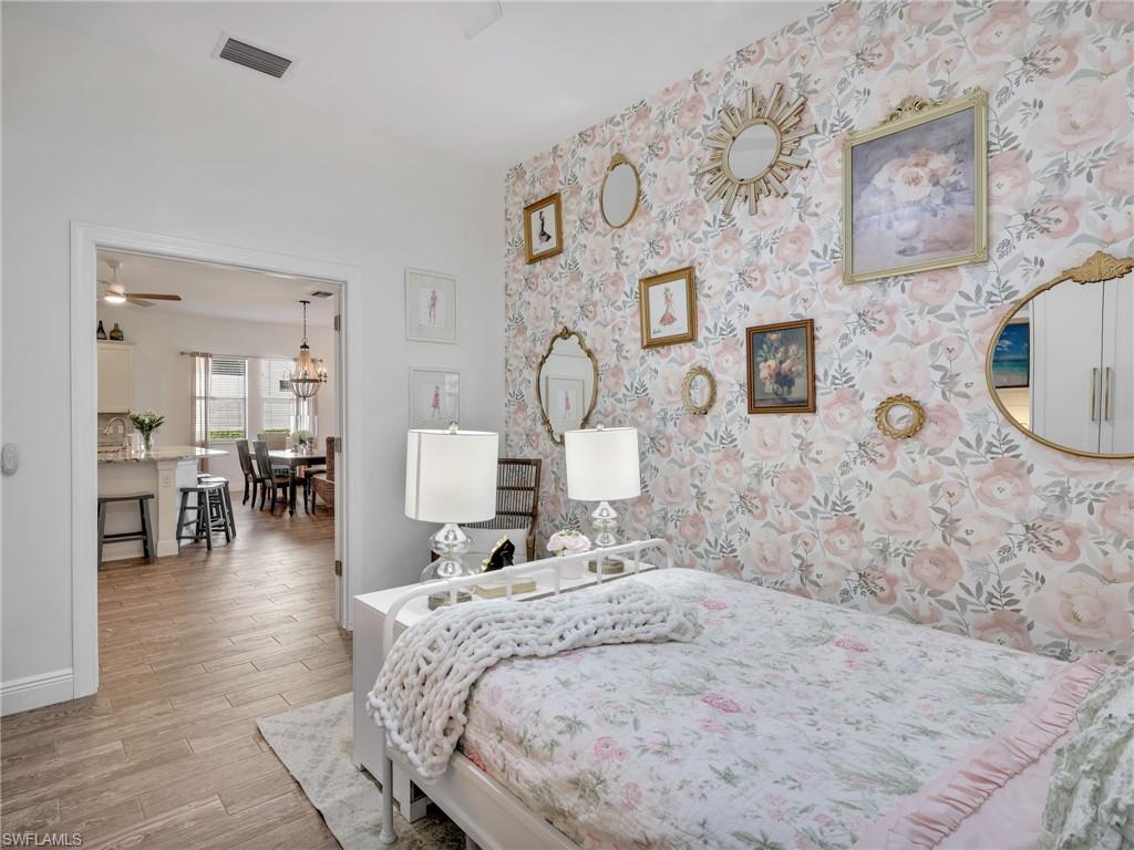 4743 Abaca Circle Naples, FL 34119 - Photo 36 of 50 Bedroom with light wood-style flooring