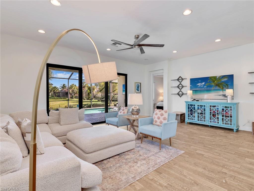 4743 Abaca Circle Naples, FL 34119 - Photo 4 of 50 Living area featuring light wood-style flooring, ceiling fan, recessed lighting, and a sunroom
