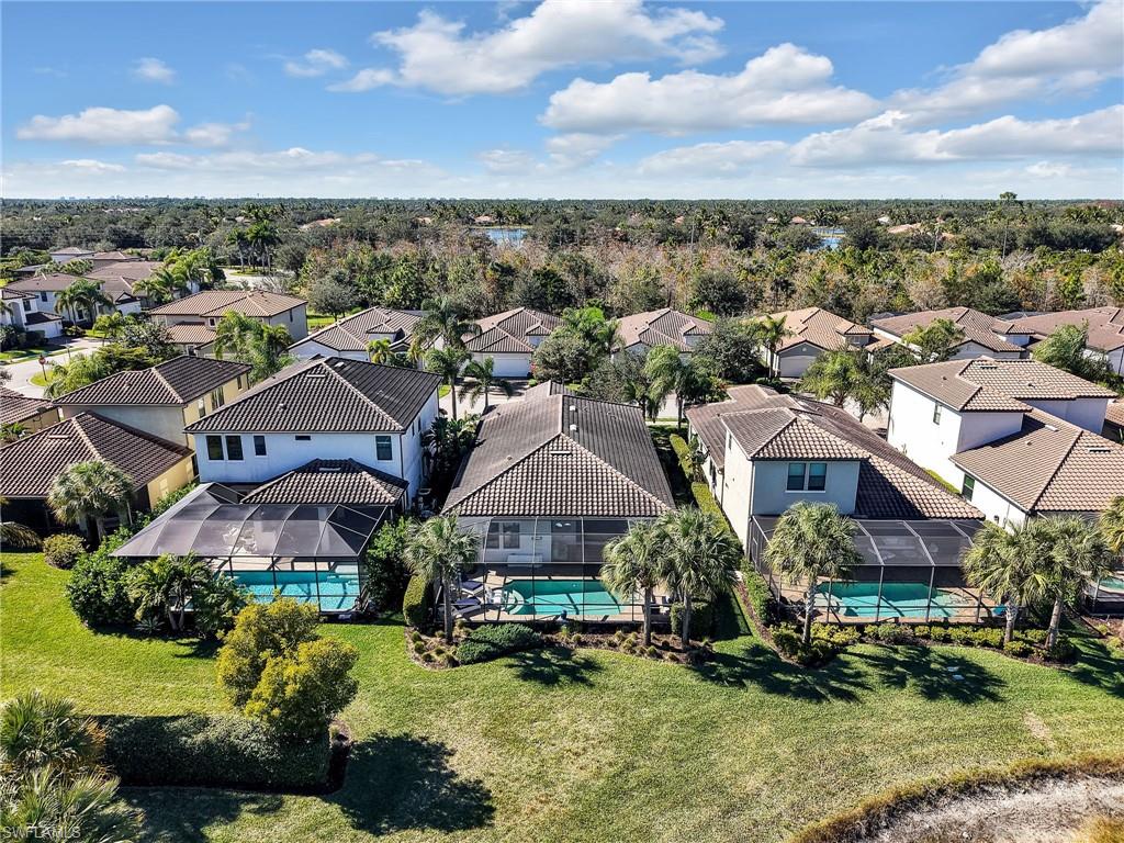 4743 Abaca Circle Naples, FL 34119 - Photo 46 of 50 Aerial view of residential area with a pool