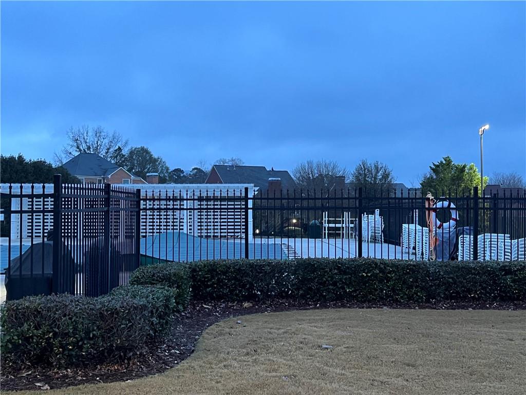 1075 Falkirk Lane Stone Mountain, GA 30087 - Photo 3 of 6 a view of a chair and table and wooden fence