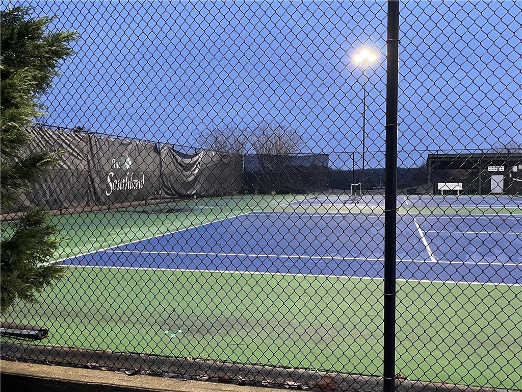 1075 Falkirk Lane Stone Mountain, GA 30087 - Photo 5 of 6 a view of a yard with wooden fence