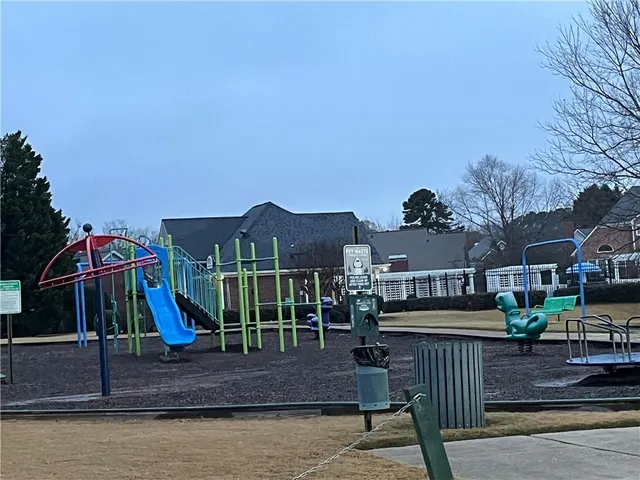 a view of house with a yard