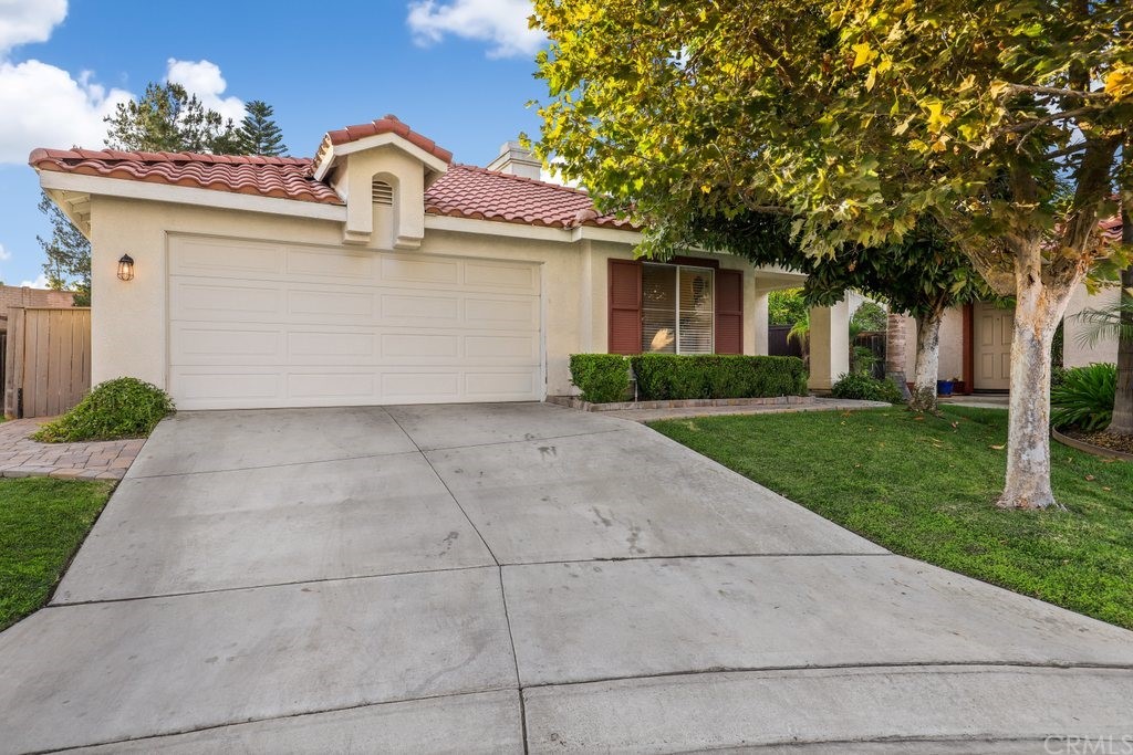118 Cape Elizabeth Way Riverside, CA 92506 - Photo 1 of 1 a front view of a house with a garden and trees