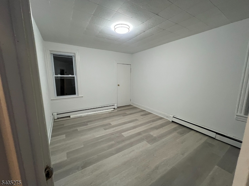 12 Quincy Street, Unit 1 Passaic, NJ 07055 - Photo 1 of 16 an empty room with a empty space