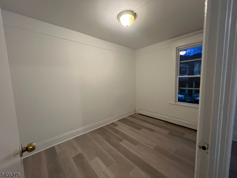 12 Quincy Street, Unit 1 Passaic, NJ 07055 - Photo 15 of 16 a view of an empty room with a window