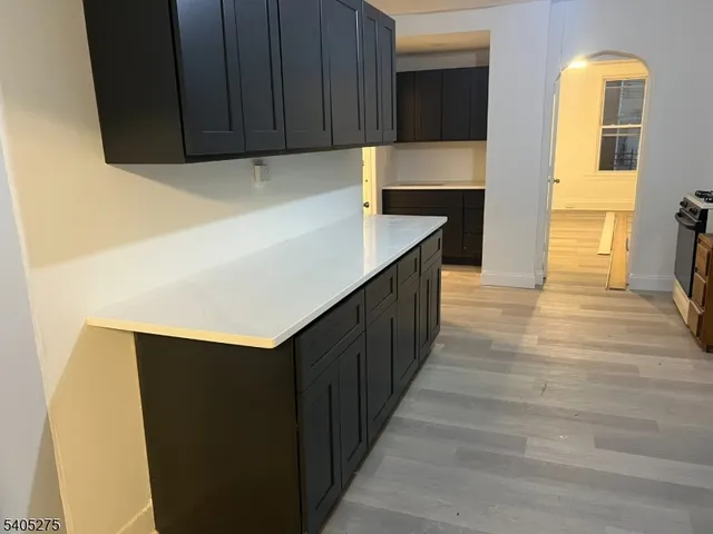 a kitchen with wooden cabinets and a sink