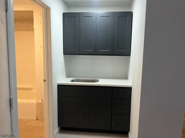 a bathroom with a sink and mirror