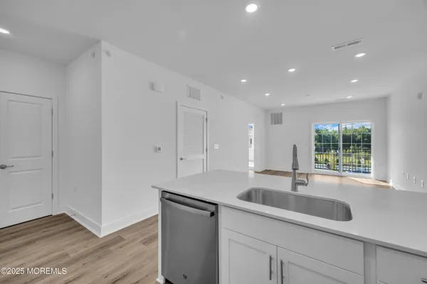 a kitchen with a sink and cabinets
