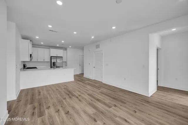 a view of kitchen with wooden floor
