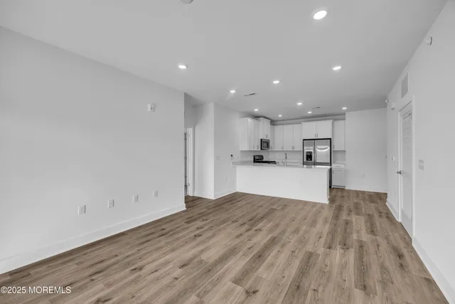 a view of kitchen with wooden floor