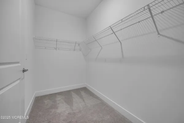 a view of a room with racks on the wall