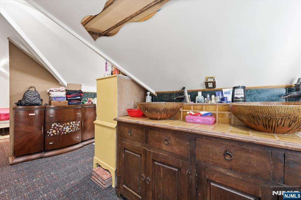 409 Tryon Avenue Englewood, NJ 07631 - Photo 24 of 33 a room with storage and utility