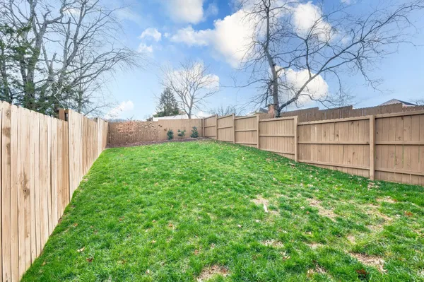 a view of a backyard of the house