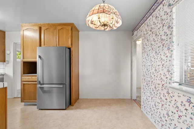 a view of a refrigerator in a kitchen