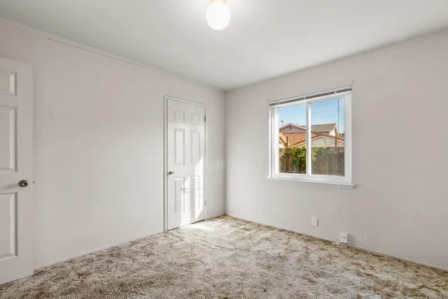 a view of an empty room and window