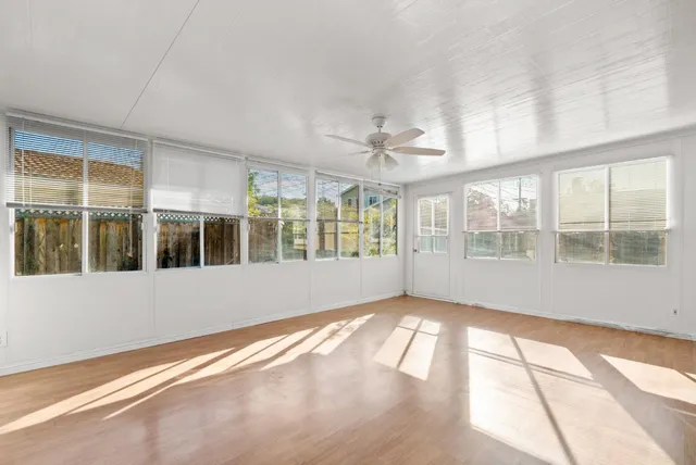 a view of an empty room with a window