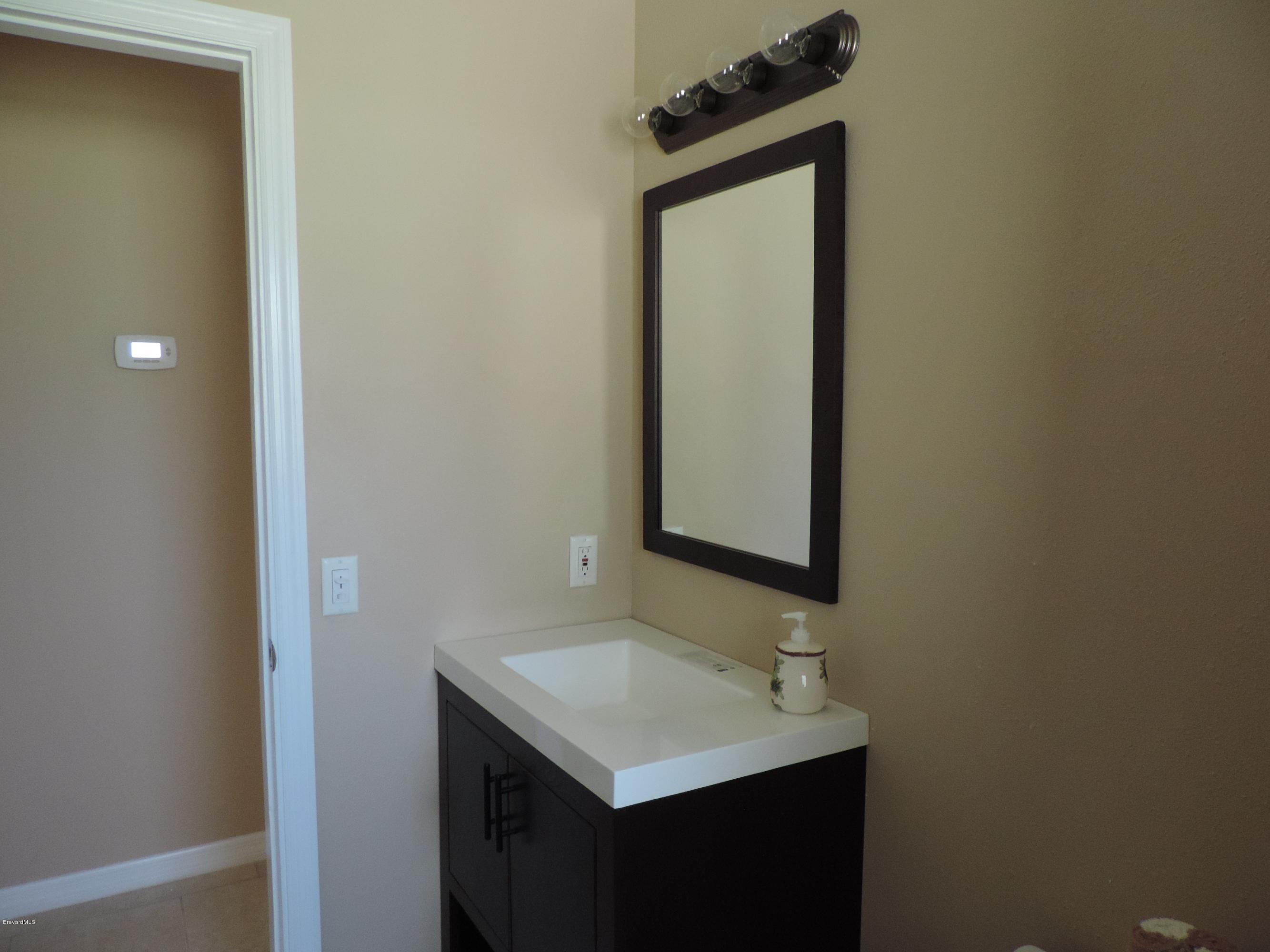 1046 Hayden Road Rockledge, FL 32955 - Photo 17 of 31 Guest Bath Vanity