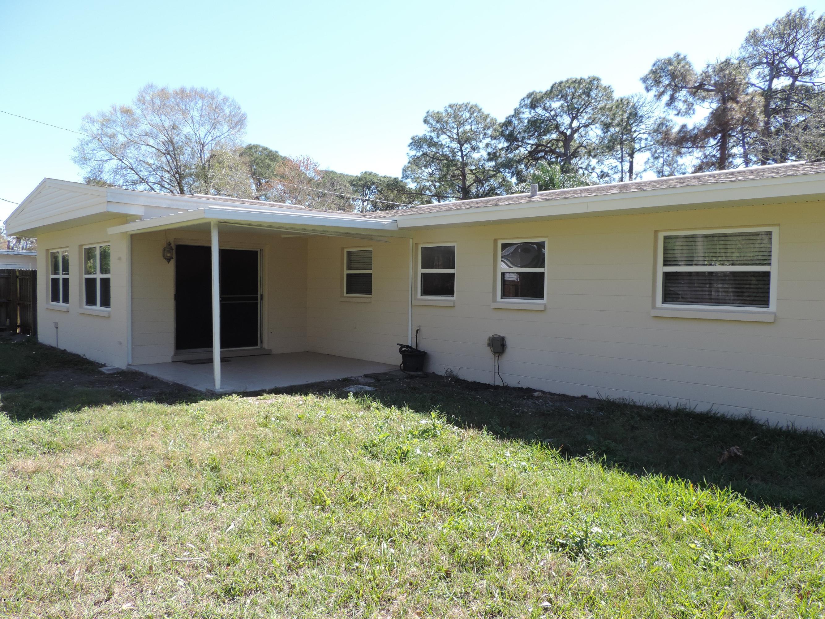 1046 Hayden Road Rockledge, FL 32955 - Photo 28 of 31 Back view to covered patio