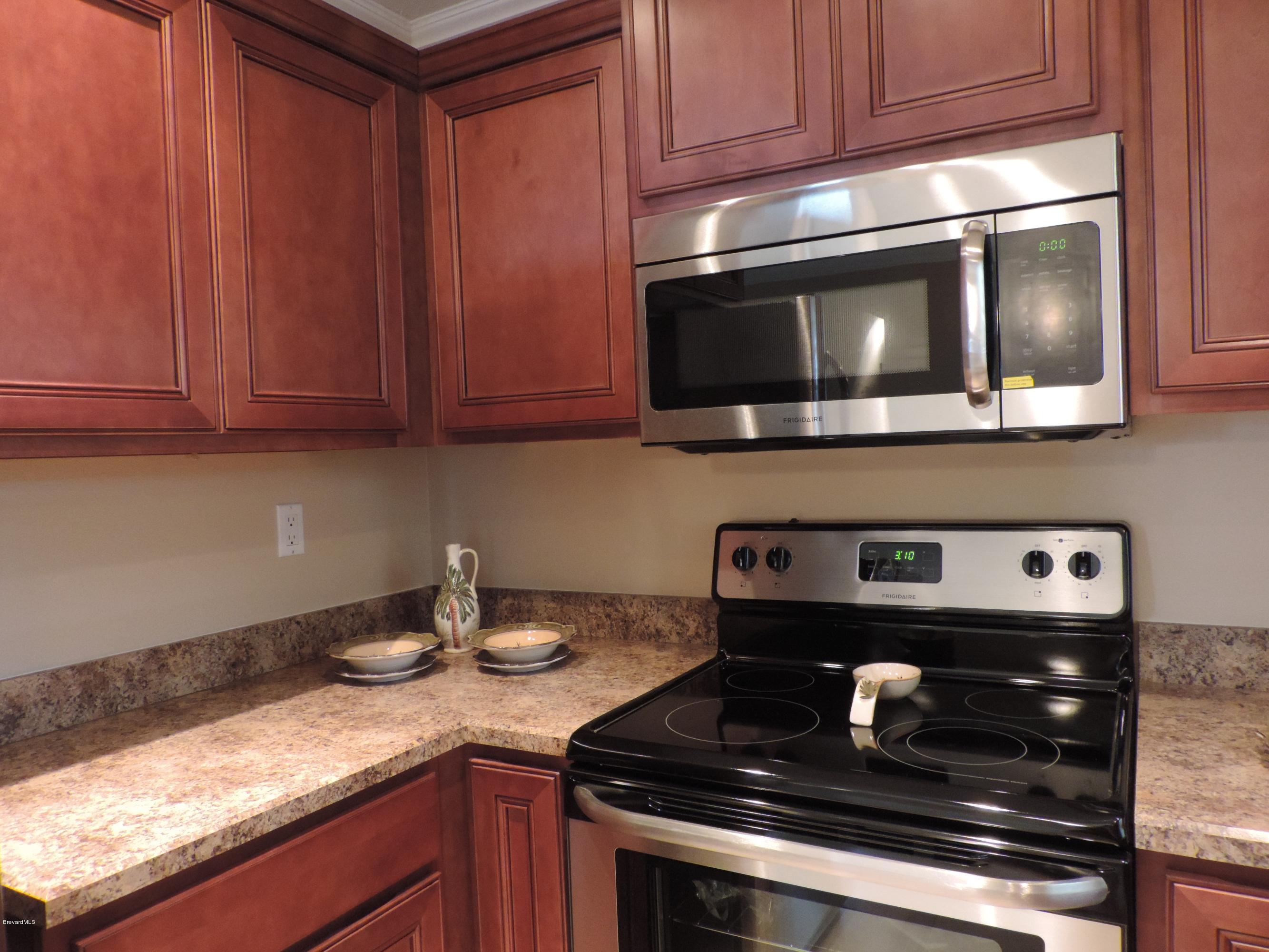1046 Hayden Road Rockledge, FL 32955 - Photo 4 of 31 Smooth top range & built in Microwave