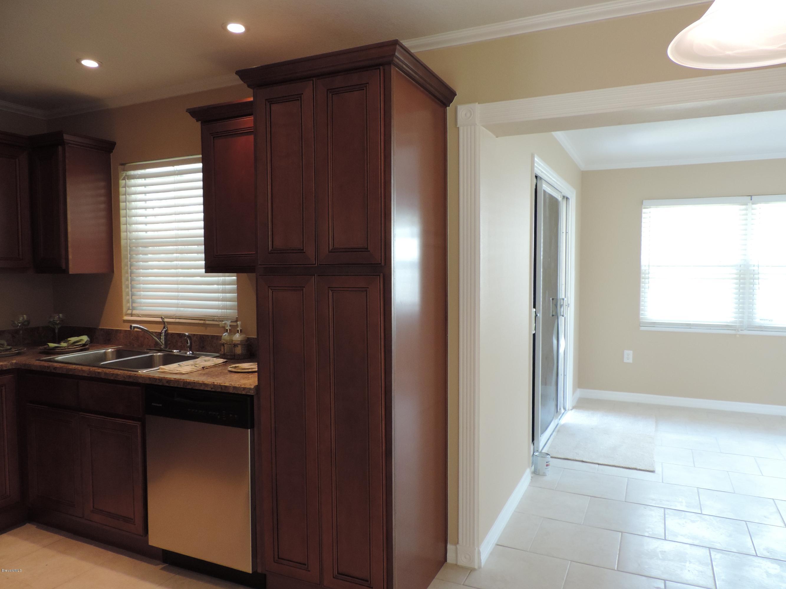 1046 Hayden Road Rockledge, FL 32955 - Photo 5 of 31 Kitchen to nook area to family room