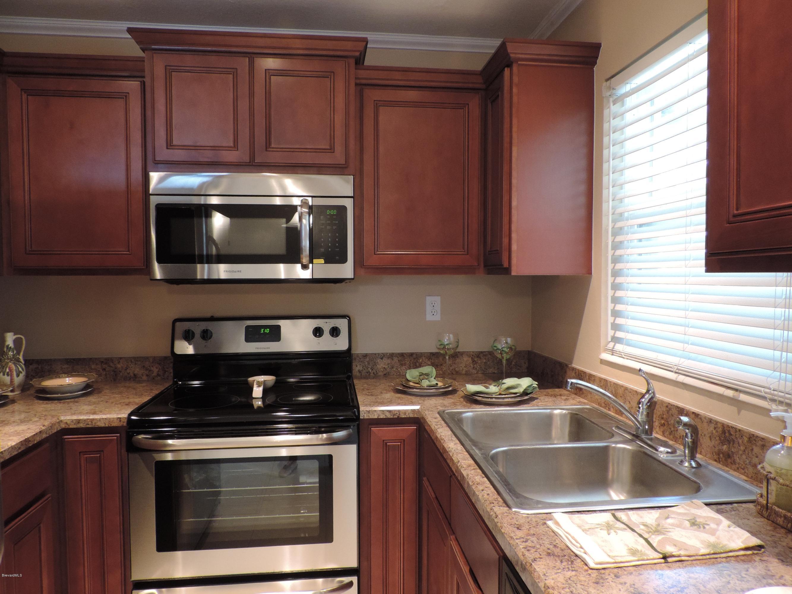 1046 Hayden Road Rockledge, FL 32955 - Photo 6 of 31 Crown molding on beautiful new cabinets