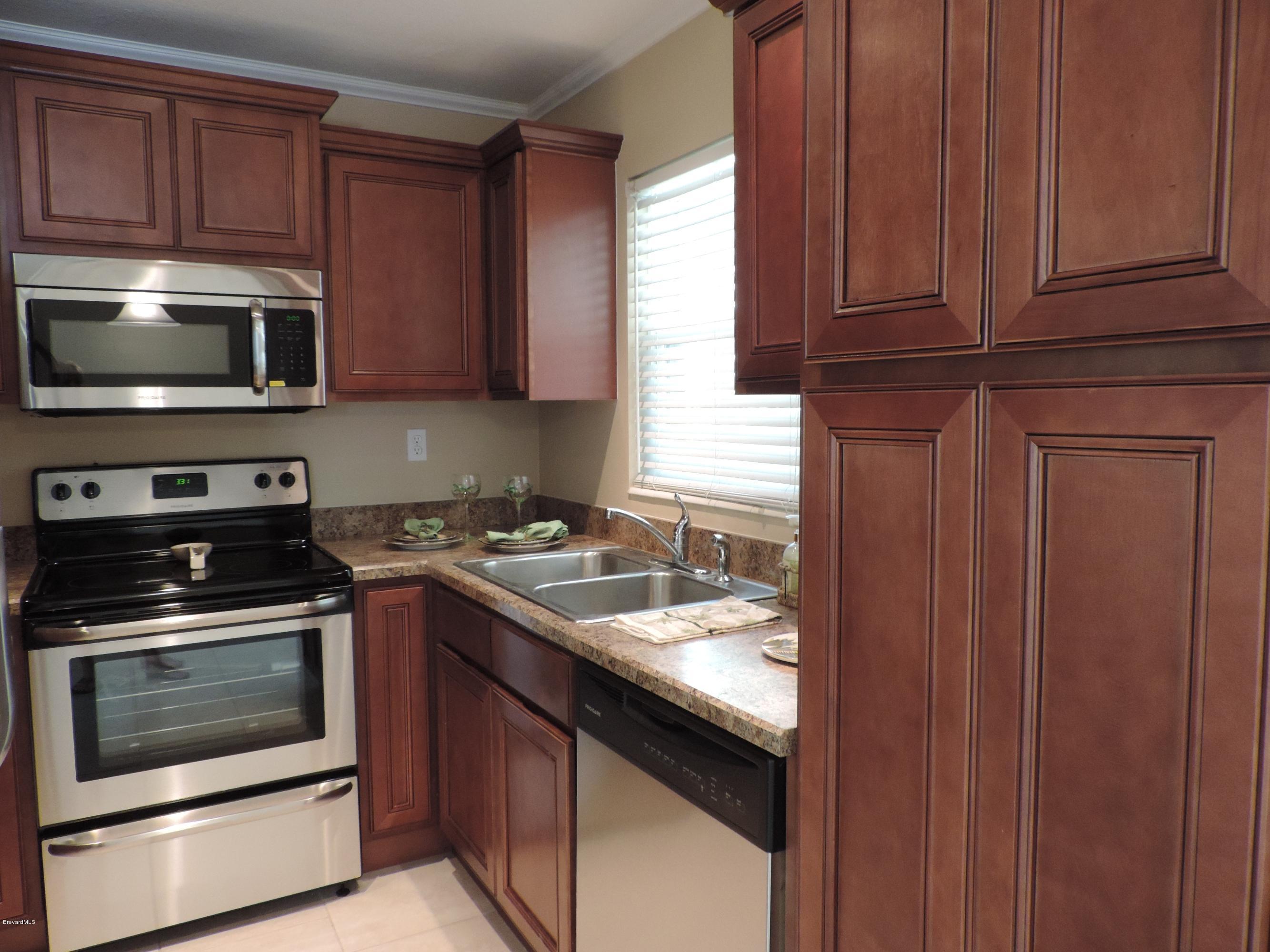 1046 Hayden Road Rockledge, FL 32955 - Photo 8 of 31 Kitchen has all new Stainless Appliances