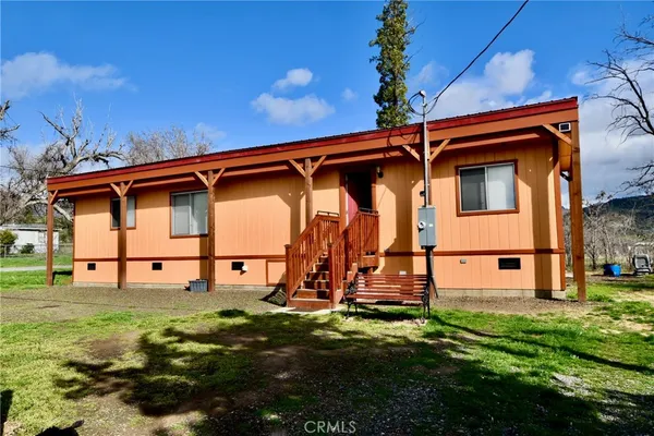a view of a two chairs in a yard