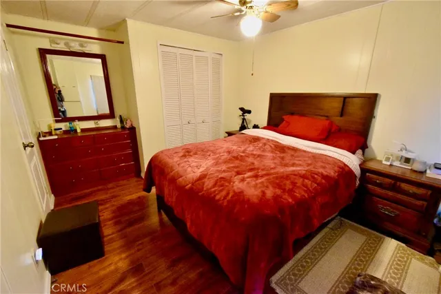 a bed sitting in a bedroom next to a small yard