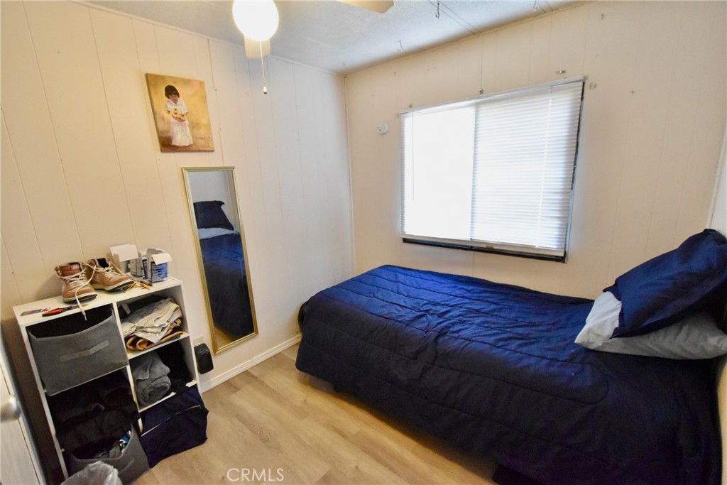 14804 Oregon Road Hornbrook, CA 96044 - Photo 19 of 26 a bedroom with a bed and wooden floor