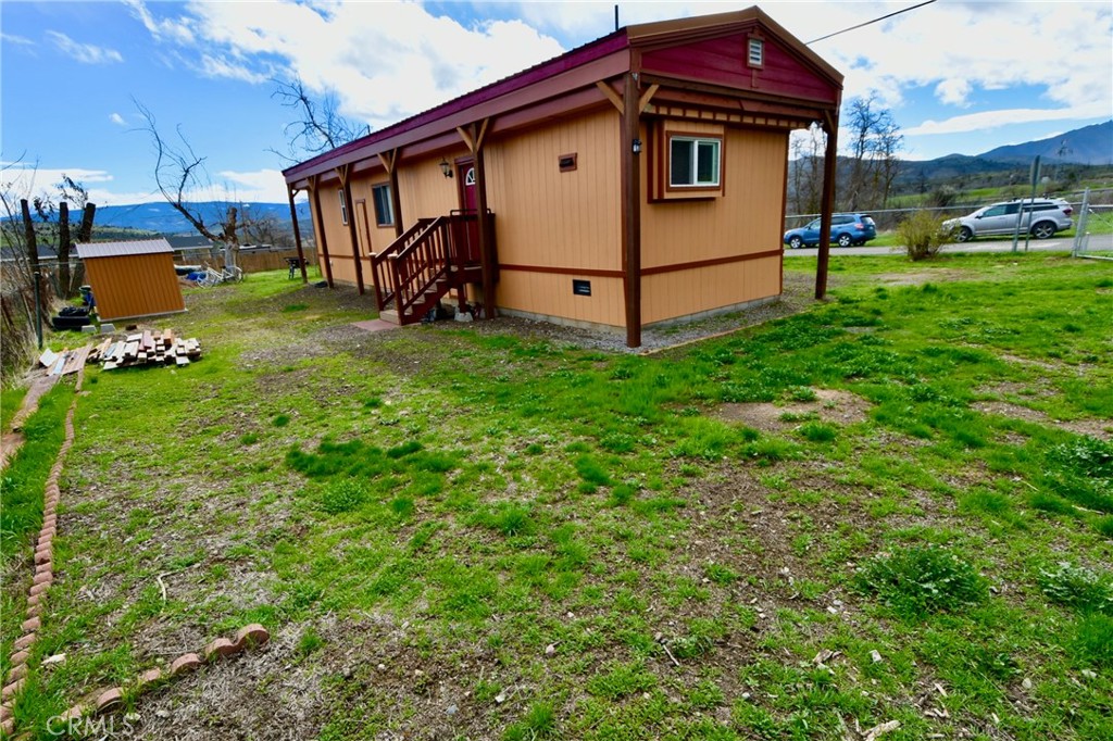 14804 Oregon Road Hornbrook, CA 96044 - Photo 26 of 26 a view of a white house with a big yard and sitting area
