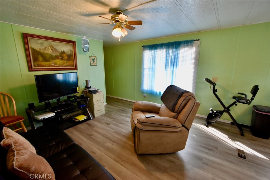 14804 Oregon Road Hornbrook, CA 96044 - Photo 3 of 26 a living room with furniture and a flat screen tv
