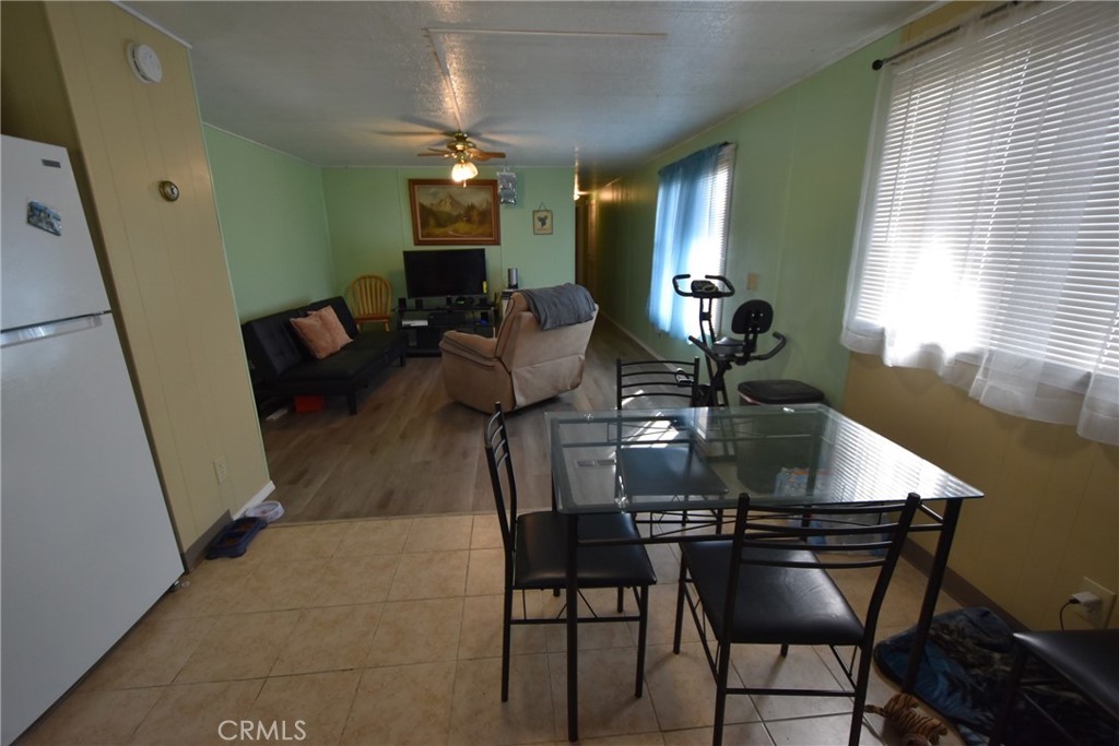 14804 Oregon Road Hornbrook, CA 96044 - Photo 5 of 26 a view of a dining room with furniture and a chandelier