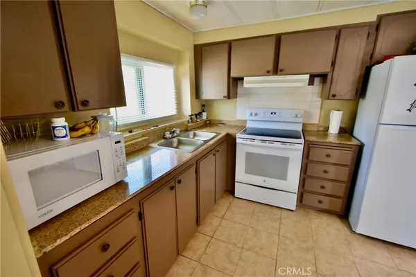a kitchen with a stove and a sink